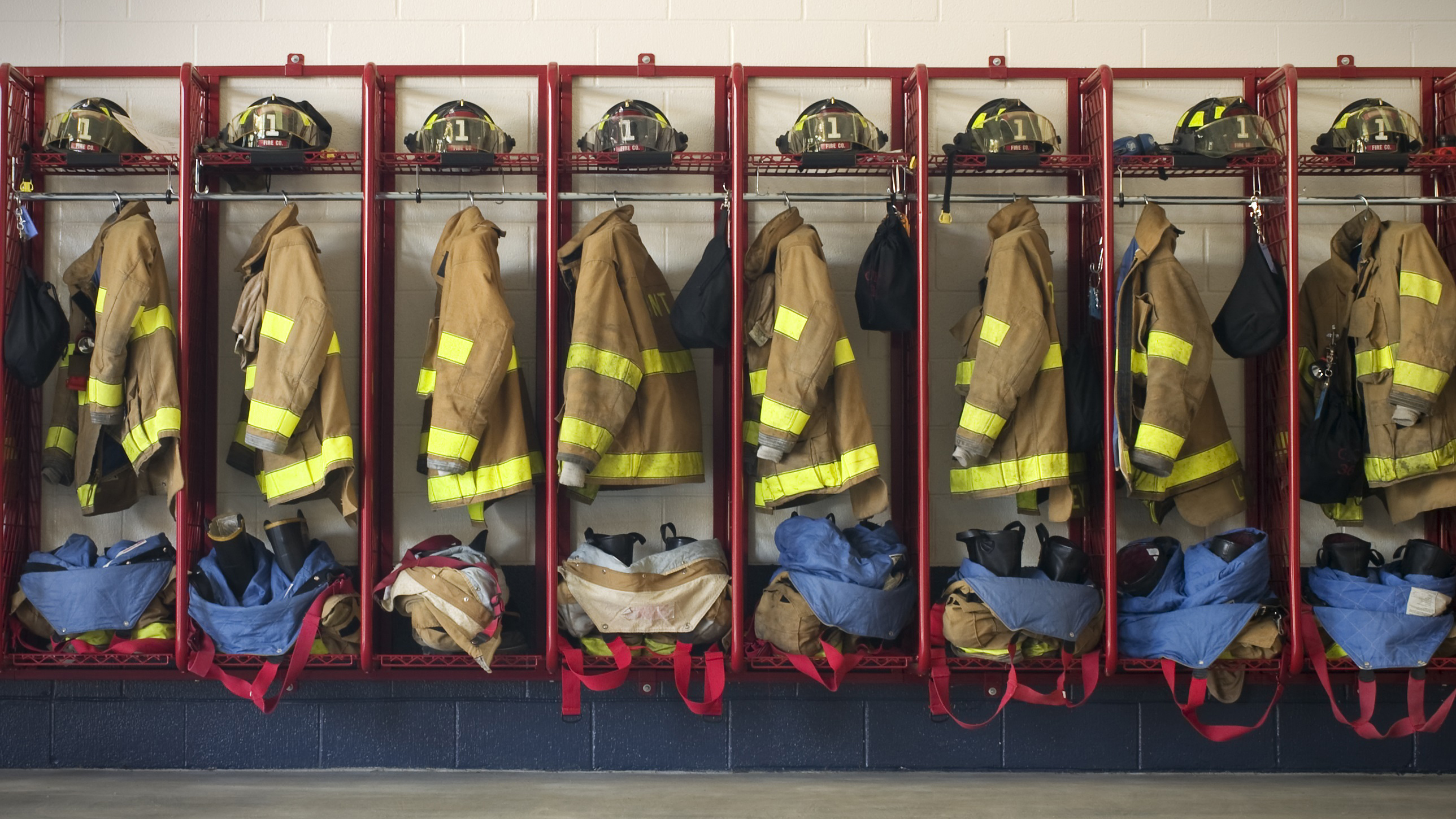 Fire uniforms hanging in lockers